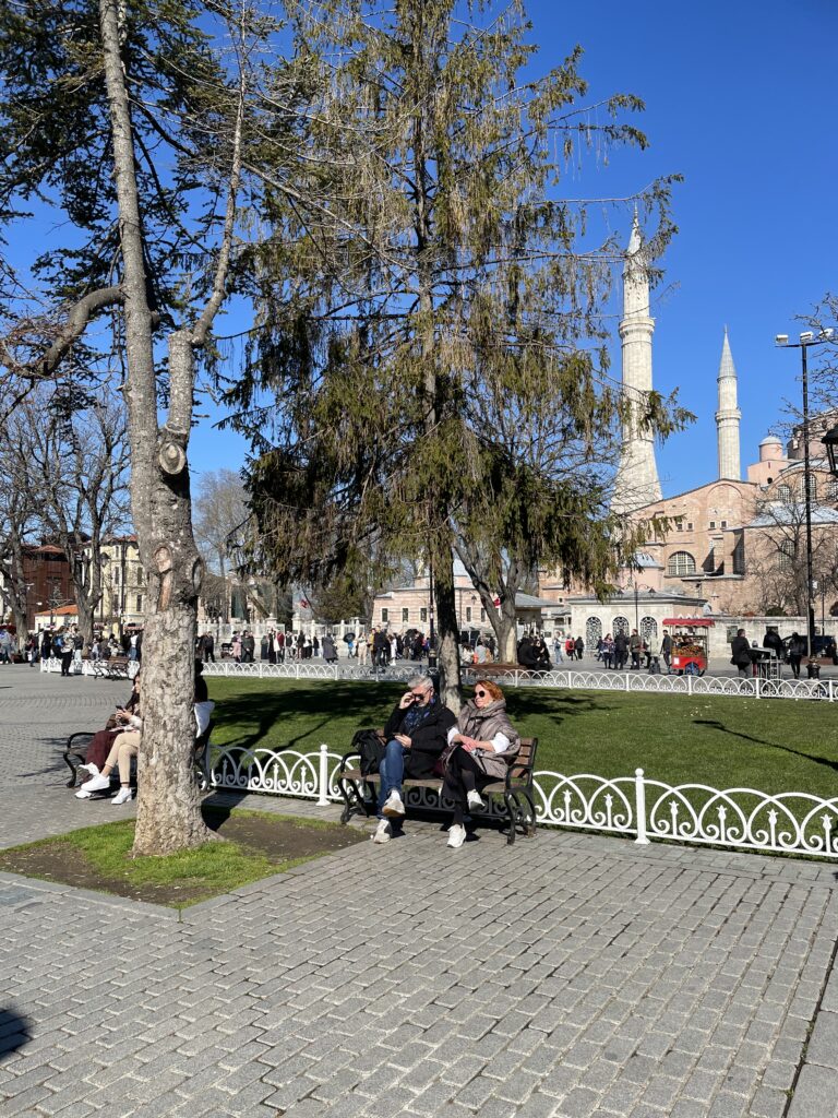 A couple sit near Haghia Sophia